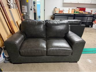 Faux leather sofa and love seat $100 obo