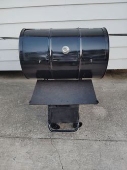 Bbq grill 55 gallon barrel bbq grill with a table on it y'all firm price $300.00 bucks peace Dion