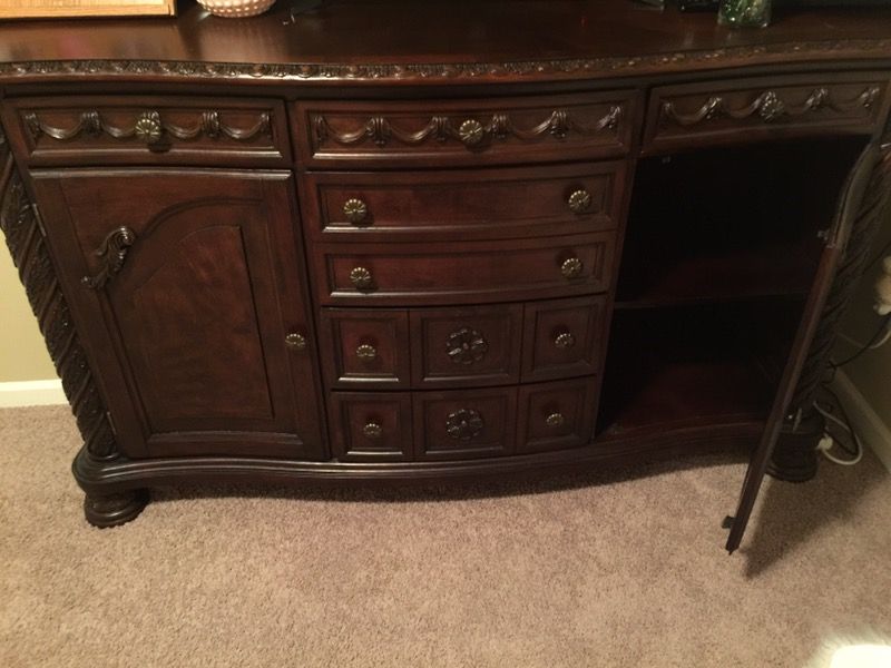 Ashley North Shore D553-60 70" Dining Room Server with Decorative Pilasters Ornately Detailed Appliques and Adjustable Shelves