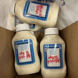 Five unopened 20 fl oz bottles of Miracle Whip Light Creamy Dressing.