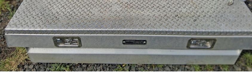 ProTech 54-8241 is a single-lid, diamond plate aluminum crossover truck tool box