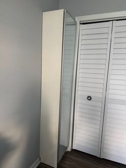 Tall white cabinet , clean  looking