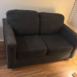 Dark charcoal, gray loveseat in great condition