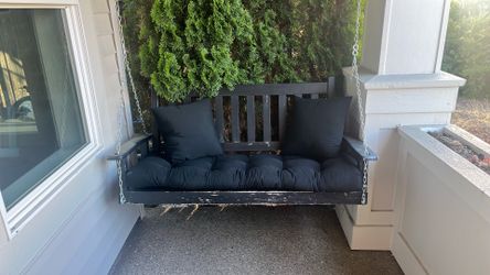 Porch swing with cushions