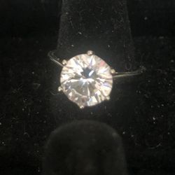 Genuine Moissanite Ring With .925 Silver Setting With Stone Being 3 mm Wide