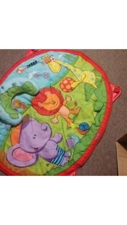 Baby play mat. Comes with head rest and a toy that attaches