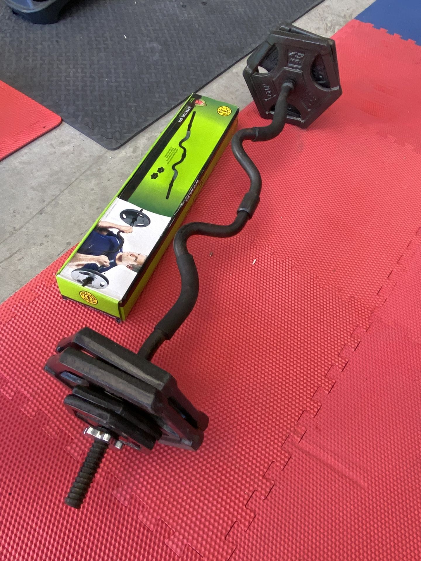 1inch curl bar with 50lb in plates $70