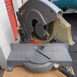 Vintage Miter Saw By Makita Mounted On A Workbench 