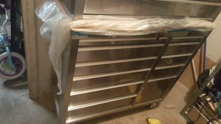 Very new stainless steel tool box on wheels filled with new tools!
