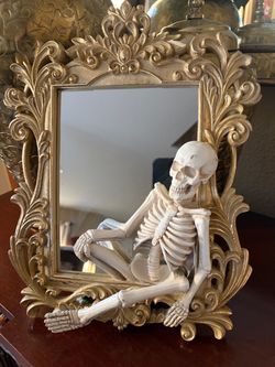 Skeleton Figure with Gold Ornate Mirror