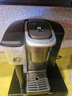 Keurig black and silver machine