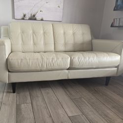 Haverty Small Sofa In Cream Color Leather. 