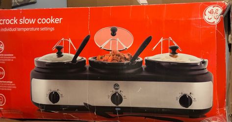 Pre-Owned still in box GE 3-Crock Slow Cooker features a brushed stainless steel heating base with three 2.5-quart removable stoneware inserts.