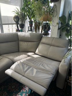 Light gray leather reclining power sofa