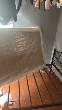 Twin size bed frame with mattress and the bottom part
