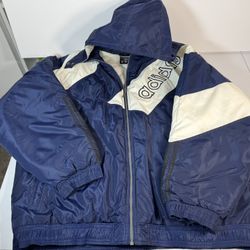 Vintage Adidas puffer jacket in deep navy with cream paneling and bold embroidered branding. Size XXL
