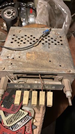This is a vintage 1960s-era Ford "All Transistor" push-button AM car radio