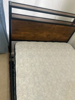 Twin size bed with mattress.