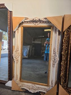 Mirror with picture frame