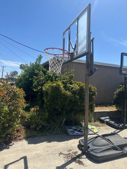 Basketball stand/hoop, portable, height adjustable.