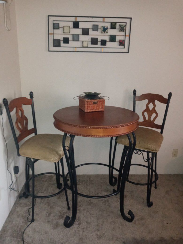 Pub Table With Two Matching Swivel Stools