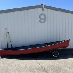 Old Town Canoe With Paddles And Pulley System.