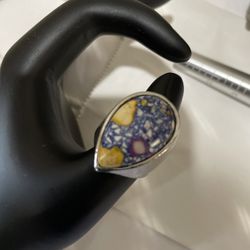 Beautiful jasper ring with bright mosaic colors of blue, yellow and purple.