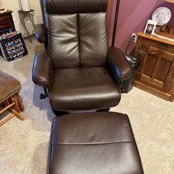 Two Brown Chairs With Ottomans 