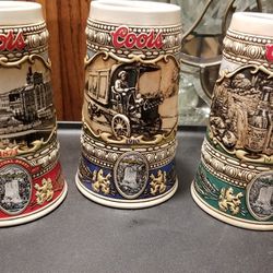 COORS VINTAGE STEINS: 'History' (1988)+ 'Rocky Mountain Legend' (1991)