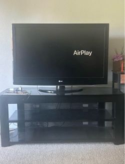 TV and table and corner bookshelf