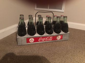 Vintage Coca-Cola 12pack glass bottles and metal holder
