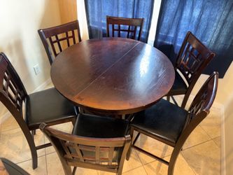 Dark Wood Round Extendable table 6 Chairs