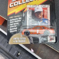 1997 American Racing Series 1:64 scale collectible die-cast car featuring Marvin Smith and his #1 Riverside race car. 