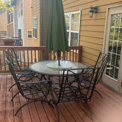 Patio Table, Chairs, Umbrella, And Cushions 