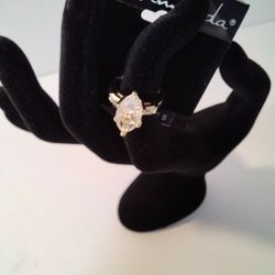 Brand New Gold Ring With Diamond Like Stones.  Size. 5" .