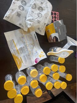 Medela hand pump and bottles