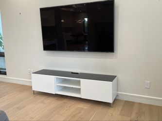 White TV Console with Black Glass Top
