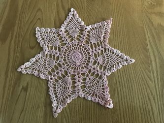 Vintage hand crocheted 7 point pink star doily 9”