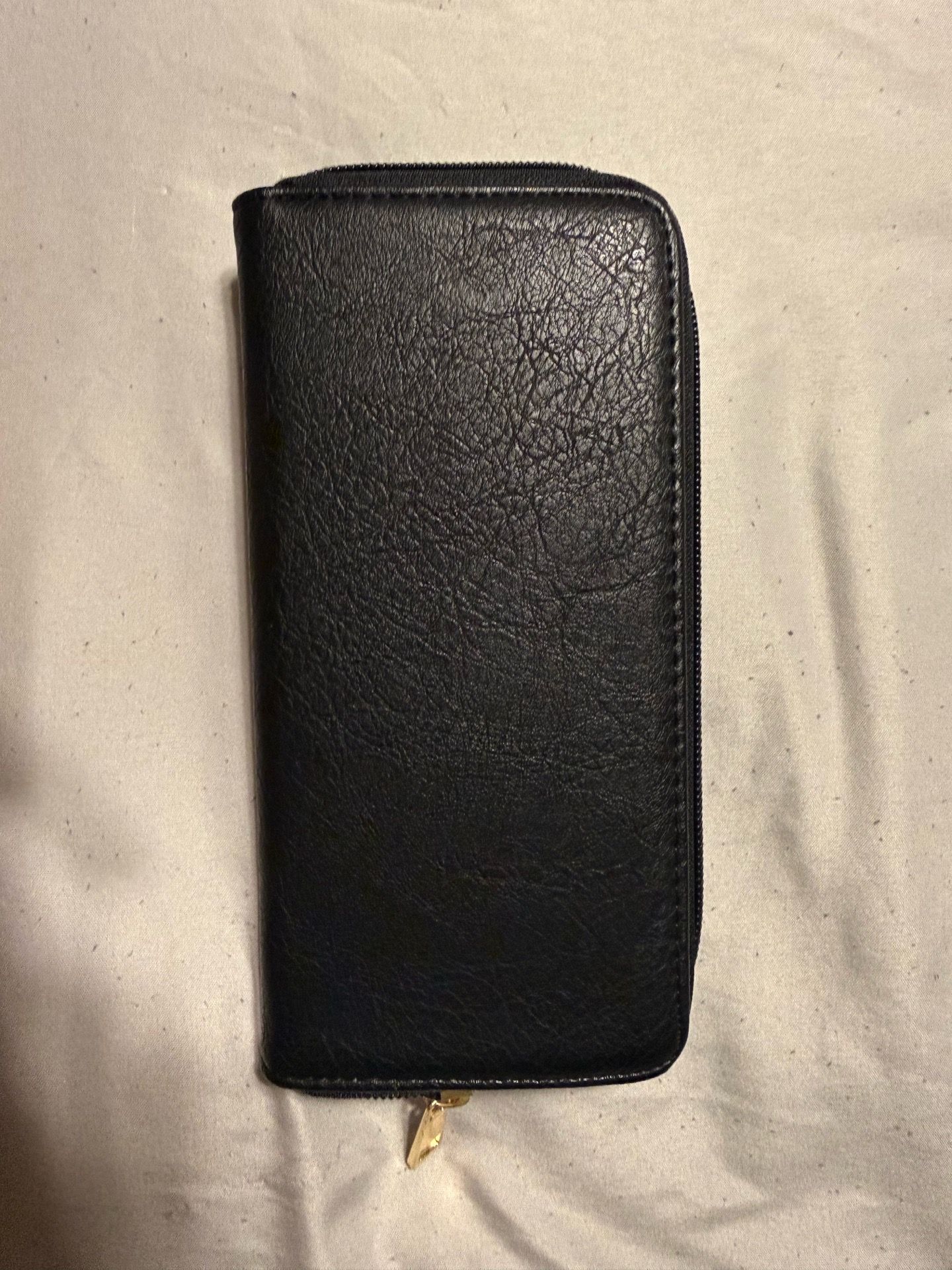 Black wallet gold accents