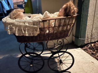 Collectible set of dolls with stroller