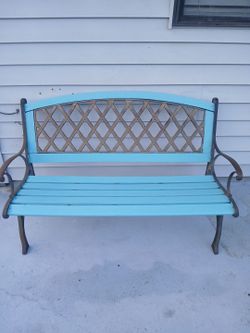 Freshly painted wood bench with metal frame