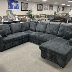 Black sofa sectional w/ pull- out sleeper & storage