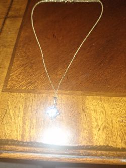 Gold Tone Necklace With A Round Cut Solitaire Pendant