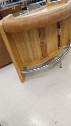Large Bar with foot Rest Chrome design on front.
