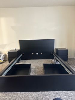 Black queen bed frame with mattress. 2 sliding drawers and 2 nightstands