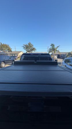 Truck bed cover and toolbox