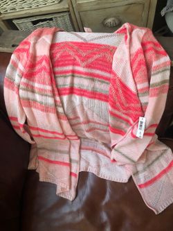 Brand new medium woman’s cardigan.