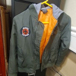 The Ring of Fire Jacket is a stylish bomber jacket designed for boys in size small. 