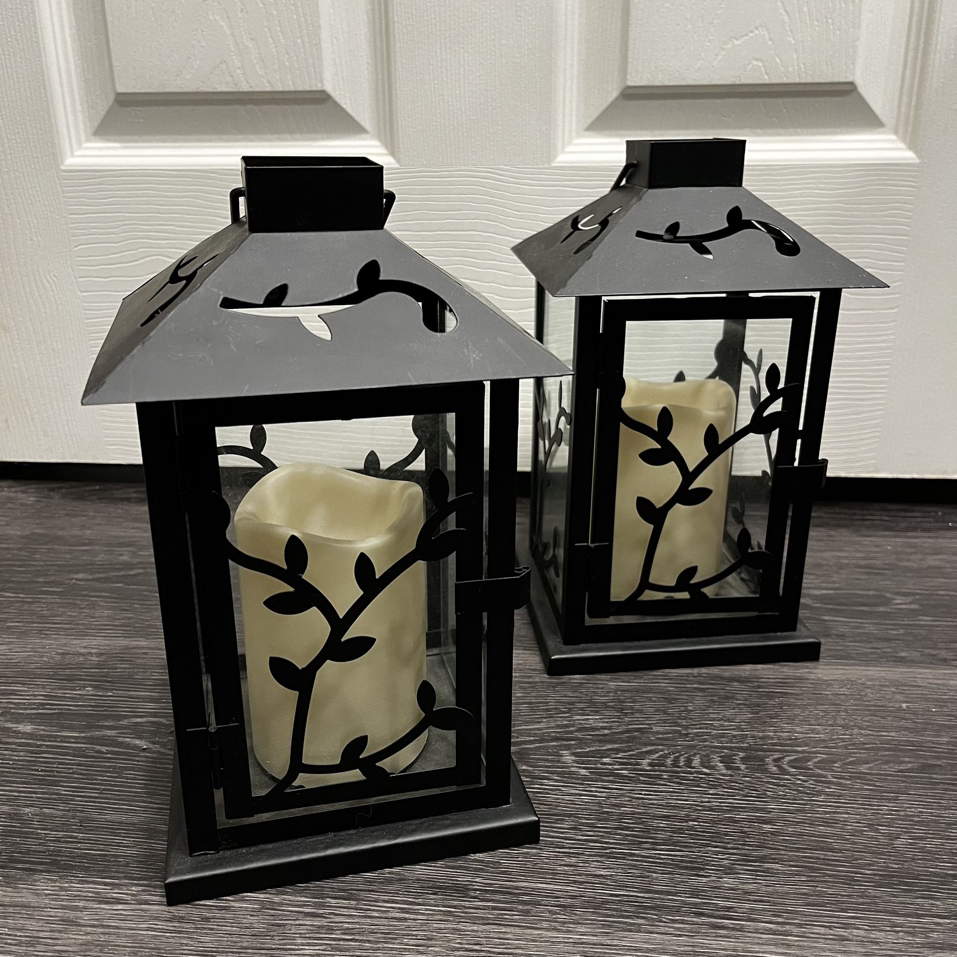 set of two metal lanterns with battery operated candles