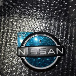 Brand New OEM Nissan Truck Emblem 